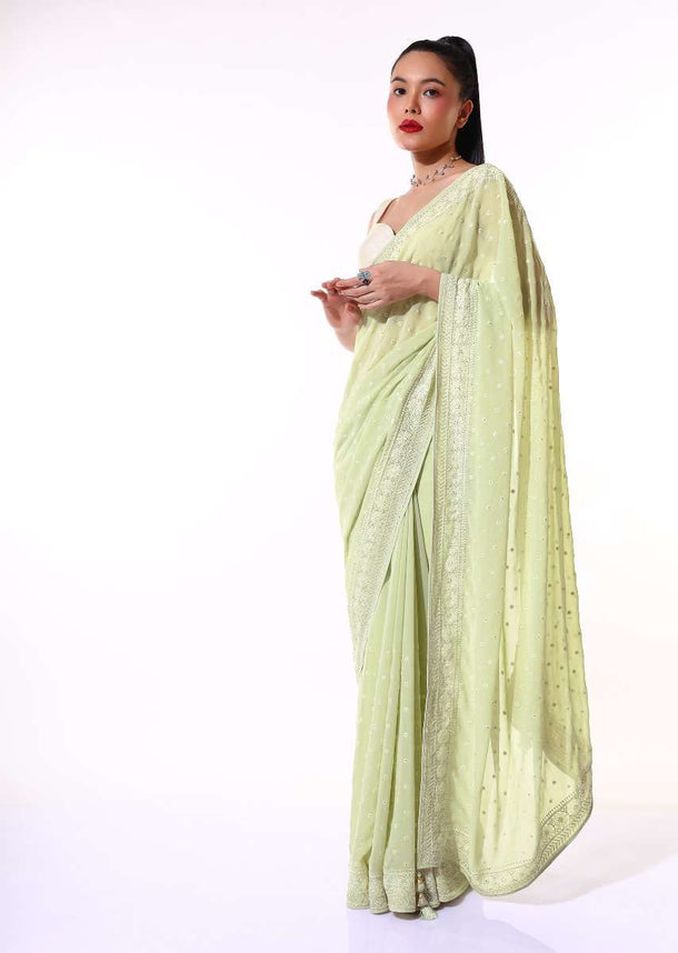 Pastel Green Saree In Georgette With Lucknowi Thread And Stone Embroidered Floral Border And Buttis Online - Kalki Fashion