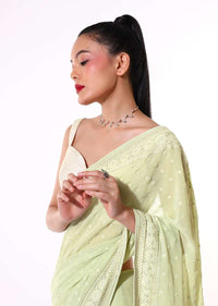 Pastel Green Saree In Georgette With Lucknowi Thread And Stone Embroidered Floral Border And Buttis Online - Kalki Fashion