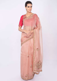 Pastel peach organza saree with coral pink raw silk blouse only on kalki