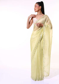 Pastel Yellow Saree In Organza With Mirror Embroidered Scallop Border Along With Cut Dana Accents Online - Kalki Fashion