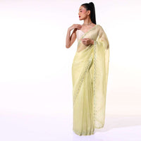 Pastel Yellow Saree In Organza With Mirror Embroidered Scallop Border Along With Cut Dana Accents Online - Kalki Fashion