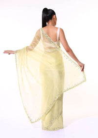 Pastel Yellow Saree In Organza With Mirror Embroidered Scallop Border Along With Cut Dana Accents Online - Kalki Fashion