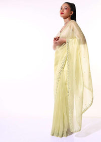 Pastel Yellow Saree In Organza With Mirror Embroidered Scallop Border Along With Cut Dana Accents Online - Kalki Fashion