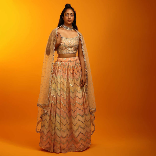 Pastel Peach And Yellow Lehenga In Georgette With Chevron And Bandhani Print And Mirror Embroidered Choli