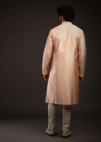 Pastel Peach Kurta Set In Brocade Silk With Woven Design All Over And Zari Work On The Placket