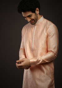 Pastel Peach Kurta Set In Brocade Silk With Woven Design All Over And Zari Work On The Placket