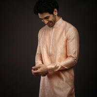 Pastel Peach Kurta Set In Brocade Silk With Woven Design All Over And Zari Work On The Placket