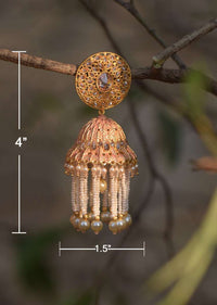 Peach And Gold Plated Jhumkas With Carved Design, Crystals And Dangling Pearl And Bead Fringes Online - Kalki Fashion