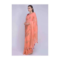 Peach dola silk saree with orange and pink tassels on the pallo only on Kalki