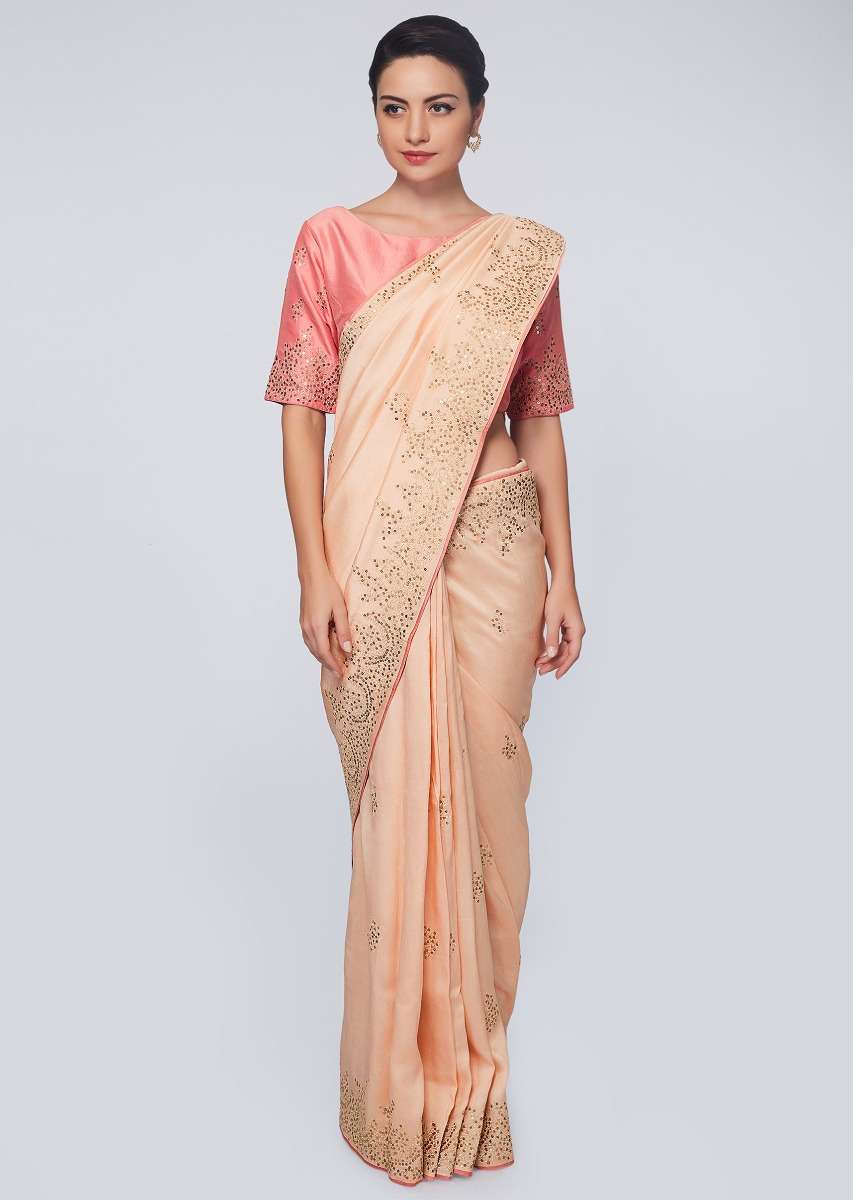 Peach raw silk saree in zari and sequins embroidered butti and border 