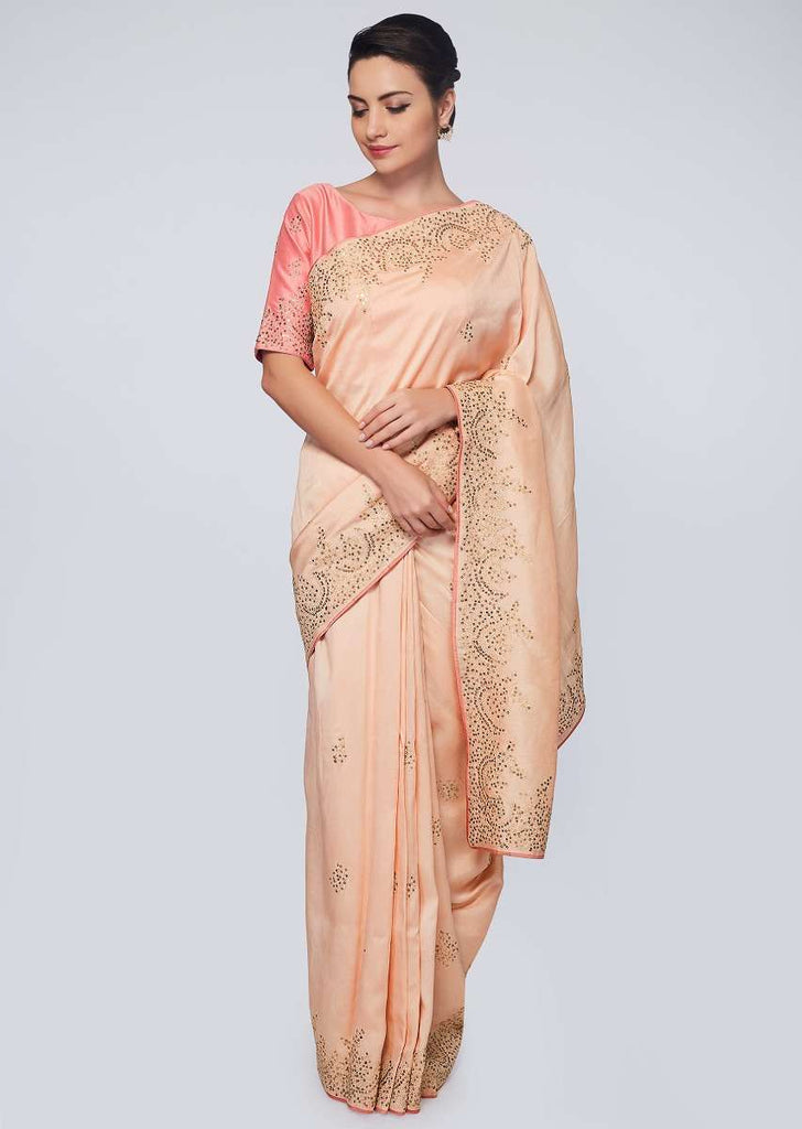 Peach raw silk saree in zari and sequins embroidered butti and border 