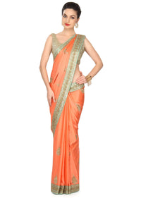 Peach saree adorn in sequin and kundan embroidery only on Kalki