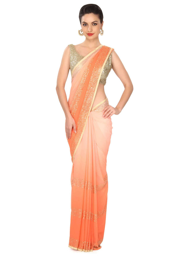 Peach shaded saree adorn in kundan embroidered border only on Kalki