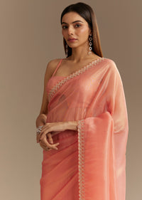 Peach Tissue Saree With Stones Cutdana Embellishments And Scallop Border