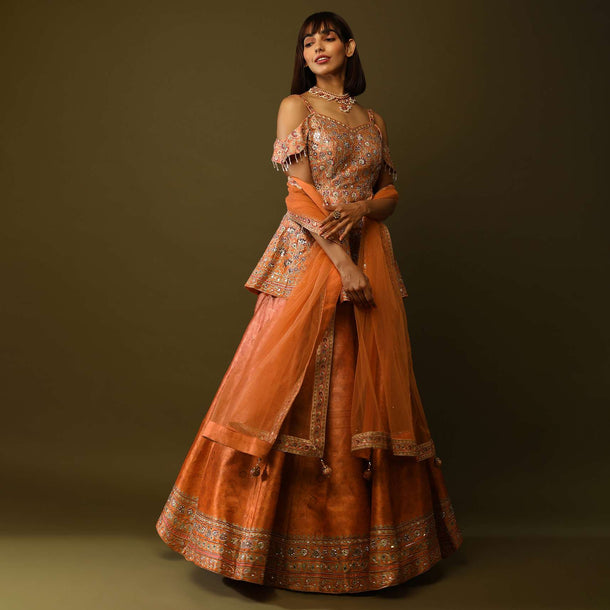 Peach And Orange Shaded Lehenga And Peplum Top With Floral Print, Mirror Work And Cold Shoulder Sleeves Online - Kalki Fashion