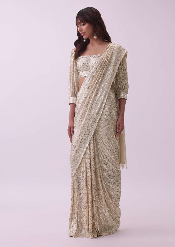 Peach Saree And Stitched Blouse With Hanging Crystals