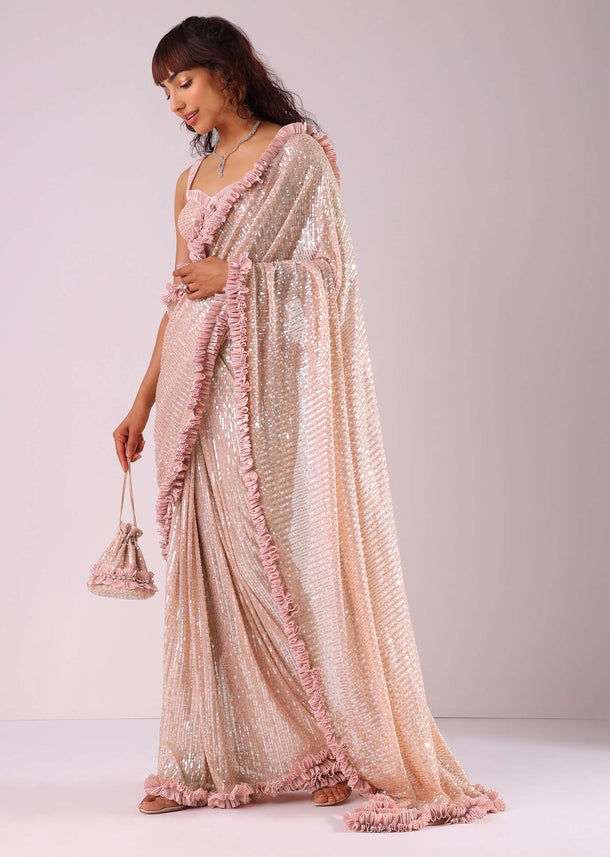 Peach Pink Ready-To-Wear Sequin Saree With Ruffle Borders And Potli