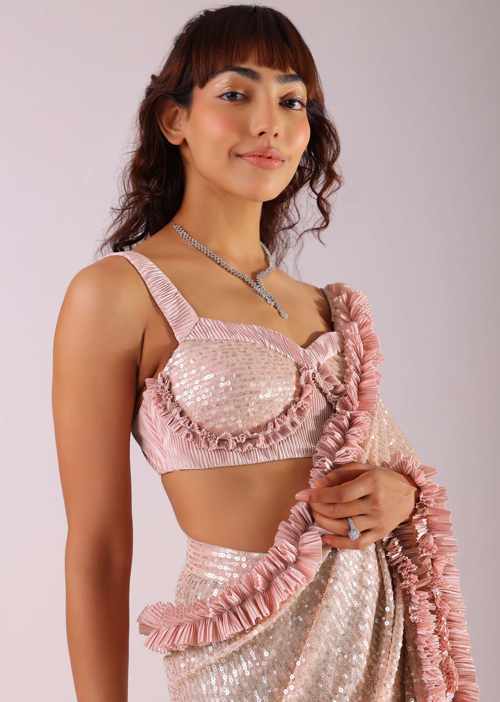 Peach Pink Ready-To-Wear Sequin Saree With Ruffle Borders And Potli