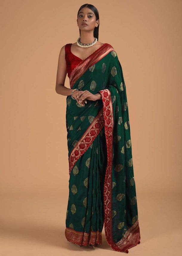 Peacock Blue Saree In Dola Silk With Brocade Leaf Shaped Buttis And Contrast Red Bandhani Border Online - Kalki Fashion