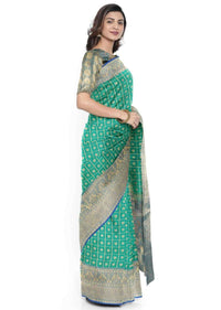 Peacock green banarasi silk saree with blue border only on Kalki