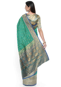 Peacock green banarasi silk saree with blue border only on Kalki