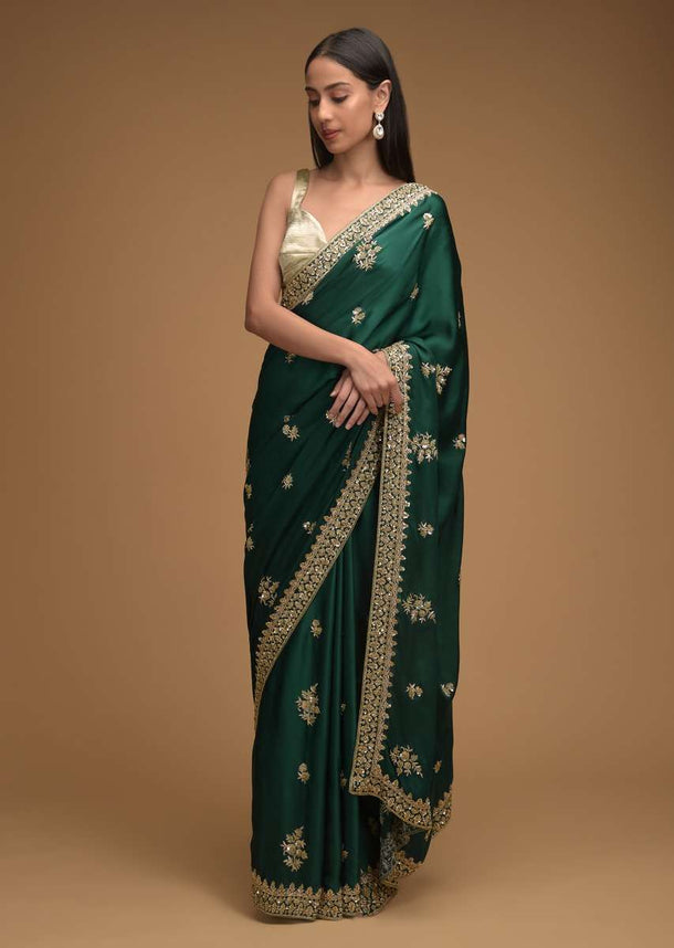 Bottle Green Saree In Satin With Hand Embroidered Floral Buttis Using Cut Dana And Sequins Work Along With Unstitched Blouse