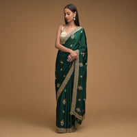 Bottle Green Saree In Satin With Hand Embroidered Floral Buttis Using Cut Dana And Sequins Work Along With Unstitched Blouse