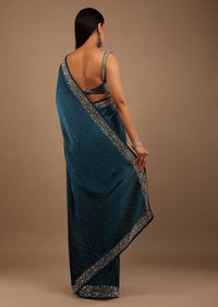 Peacock Blue Satin Saree With Stone Work On The Border