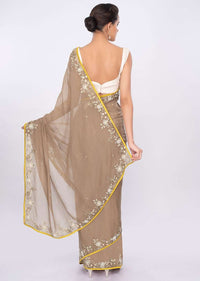 Peanut brown organza saree with floral embroidered border only on kalki