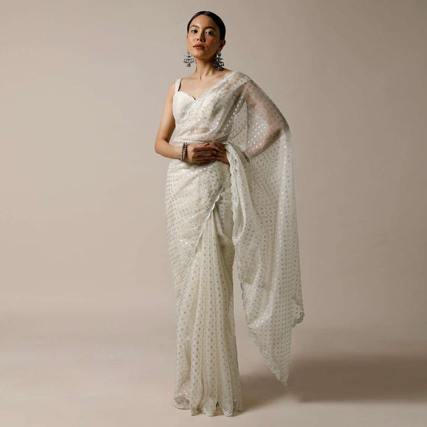 Pearl White Saree In Organza With Foil Printed Buttis And Mirror Work On The Border Along With Unstitched Blouse