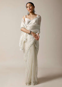 Pearl White Saree In Organza With Foil Printed Buttis And Mirror Work On The Border Along With Unstitched Blouse