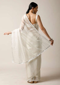 Pearl White Saree In Organza With Foil Printed Buttis And Mirror Work On The Border Along With Unstitched Blouse