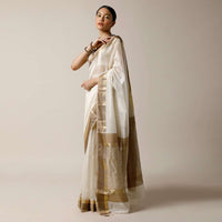 Pearl White Saree In Cotton Silk With Woven Golden Border And Contrasting Unstitched Blouse