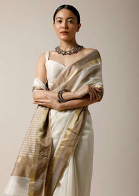 Pearl White Saree In Cotton Silk With Woven Golden Border And Contrasting Unstitched Blouse