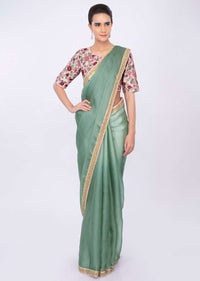 Persian green organza saree with pink floral embroidered blouse only on kalki