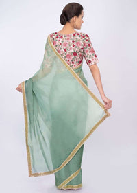 Persian green organza saree with pink floral embroidered blouse only on kalki