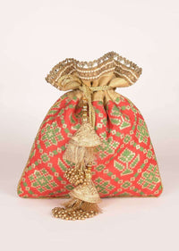 Persian Red Potli In Brocade Silk With Green And Gold Weaved Geometric Floral Pattern Online - Kalki Fashion