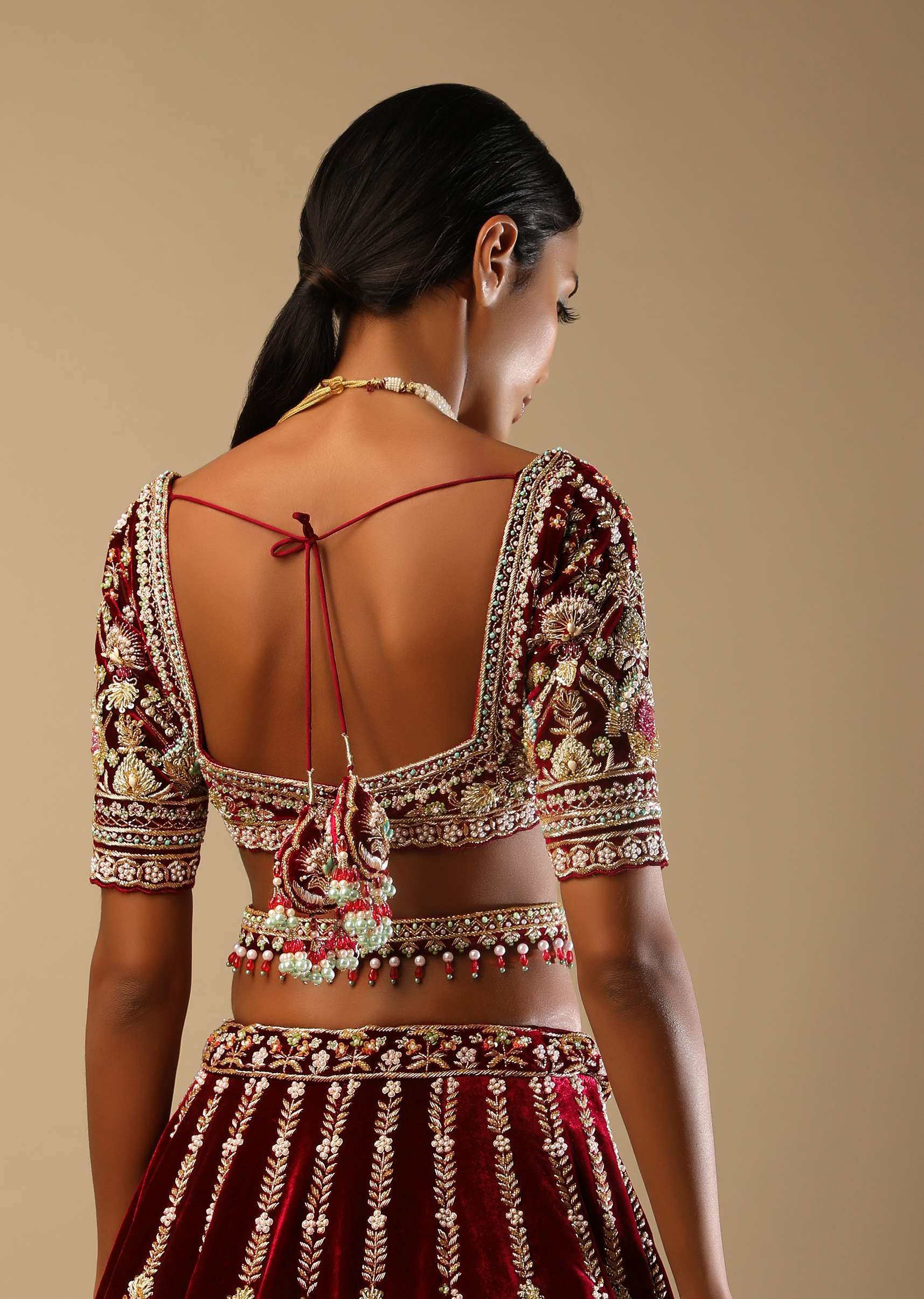 Persian Red Lehenga Choli In Velvet With Multi Colored Hand Embroidered Mughal Kalis And Floral Motifs