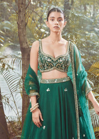 Srushti Porey In Kalki Pine Green Lehenga Choli In Raw Silk With Butti Work And Heavy Hand Embroidery In Mughal Motifs On The Choli
