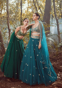 Srushti Porey In Kalki Pine Green Lehenga Choli In Raw Silk With Butti Work And Heavy Hand Embroidery In Mughal Motifs On The Choli