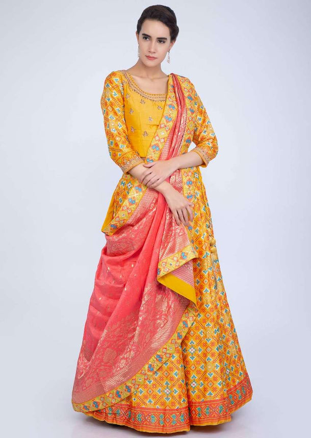 Pine Yellow Lehenga With Patola Print And Contrasting Punch Pink Weaved Dupatta Online - Kalki Fashion