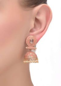 Pink And Gold Jhumkas With Intricate Carving Embellished With Crystal And Pearls Online - Kalki Fashion