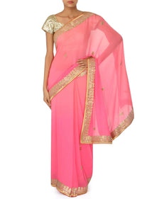 Champagne pink saree adorn in gotta patch embroidered border only on Kalki