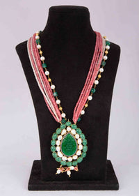 Pink shaded multi string necklace with a pearl drop shaped huge pendant in green beads only on Kalki