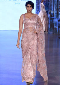 Pink embroidered net saree with scalloped border only on Kalki