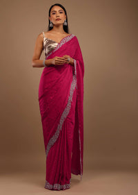 Pink Satin Saree With Heavy Stone Work On The Borders In A Floral Design