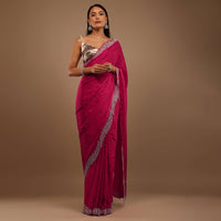 Pink Satin Saree With Heavy Stone Work On The Borders In A Floral Design
