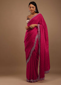 Pink Satin Saree With Heavy Stone Work On The Borders In A Floral Design