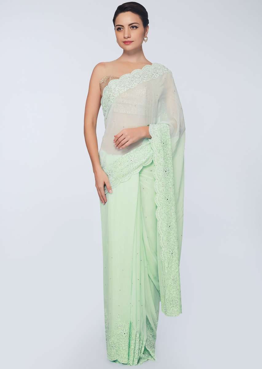 Pista green georgette saree in self thread floral embroidered border