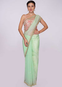 Pista green organza saree with floral embroidered pallo